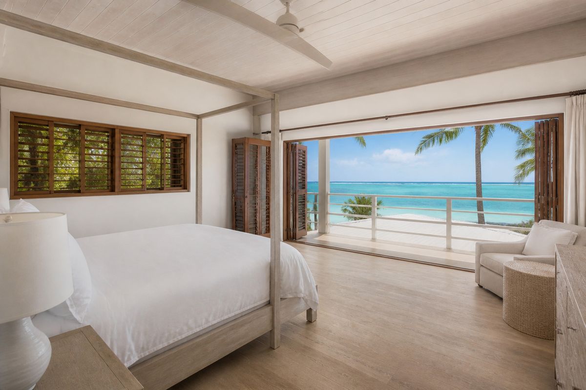 Primary bedroom with sea view — AI-generated demo photograph